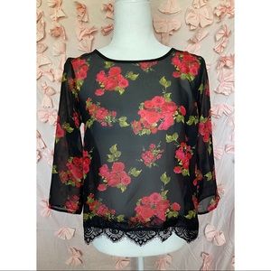 Red flowers on black top, sheer top.